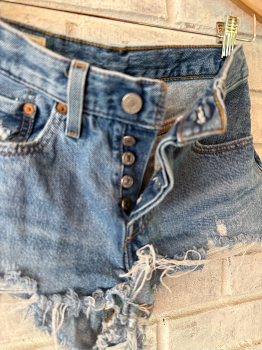 Vintage 501 LEVIS High-Rise Distressed Denim Shorts in Light Blue